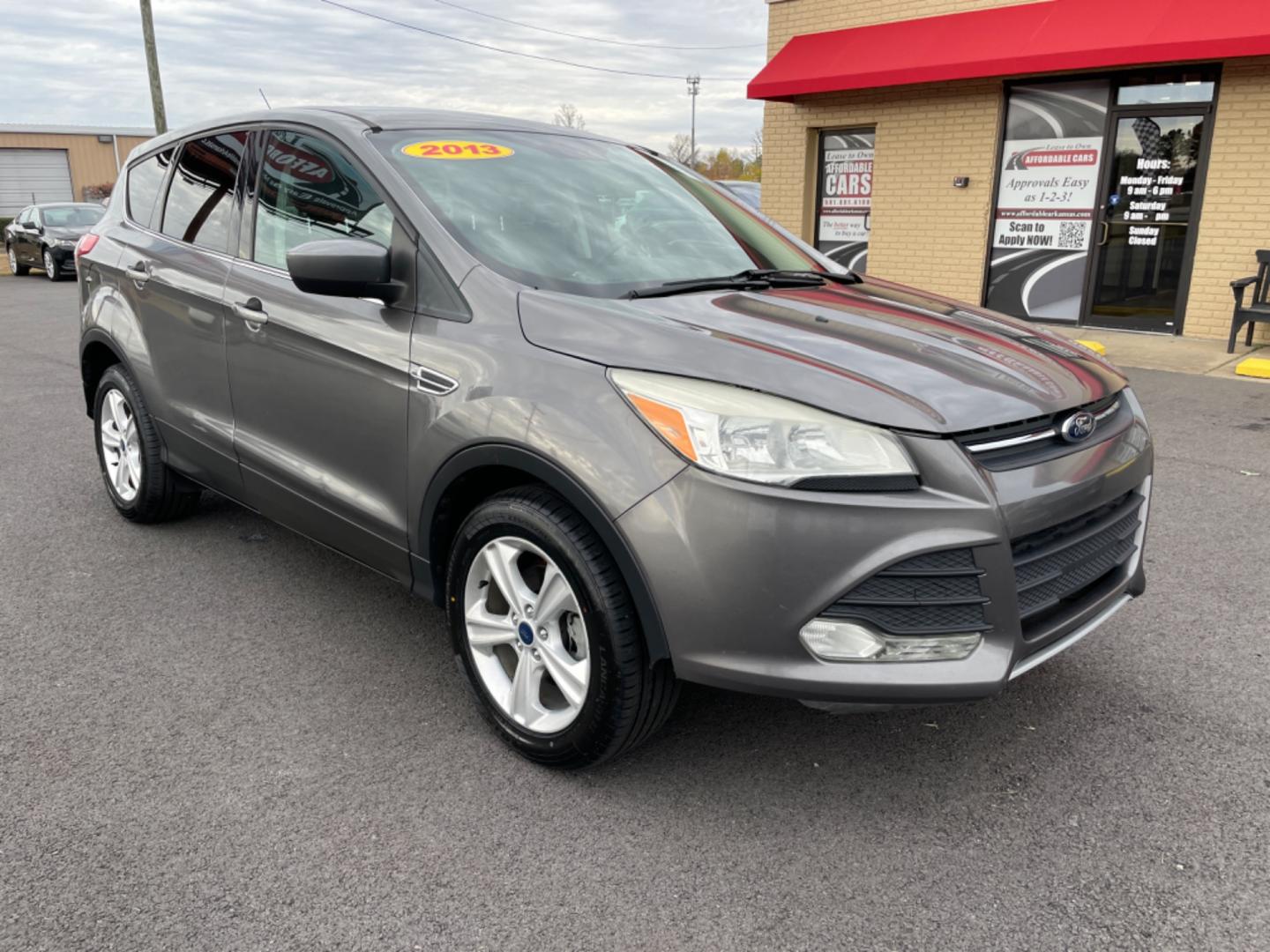 2013 Gray Ford Escape (1FMCU0GX1DU) with an 4-Cyl, EcoBoost, 1.6L engine, Auto, 6-Spd w/SelShft transmission, located at 8008 Warden Rd, Sherwood, AR, 72120, (501) 801-6100, 34.830078, -92.186684 - Photo#1